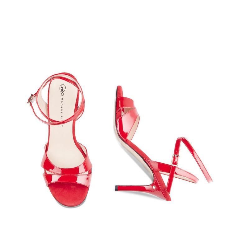 Virginia in soft candy red patent leather is a showstopper worthy of your attention. Designed and made in Italy, this classic style has a two-band strap across the toes and a slim sandal back. Perfect for your memorable event or a lovely dance after hours, you can't go wrong with adding Virginia to your closet. The shoe is finished with a subtle signature brilliant adornment on the left heel. With a soft memory foam footbed padding, you are comfortable from the very first wear. Glitter overlay O Evening Heels With Single Toe Strap In Patent Leather, Classic Heels With 4-inch Heel And Single Toe Strap, Elegant Glossy Sandals For Party, Elegant Evening Sandals With Glossy Finish, Double Strap Heels With Heel Strap, Elegant Glossy Evening Sandals, Glossy Finish Sandals For Formal Occasions, Elegant Patent Leather Heels With Single Toe Strap, Elegant Heels With Single Toe Strap In Patent Leather