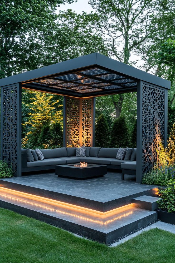 an outdoor living area is lit up with lights