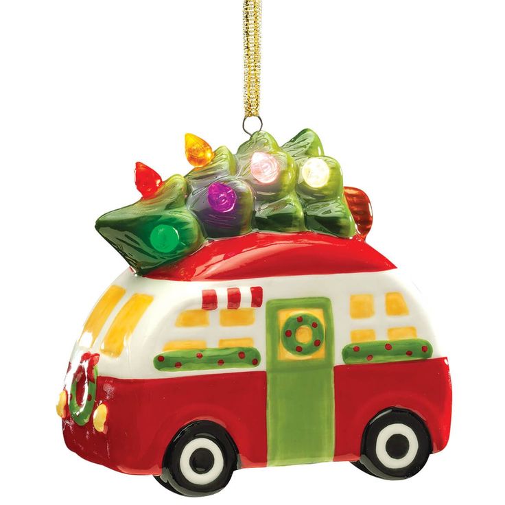 an ornament shaped like a camper with christmas lights