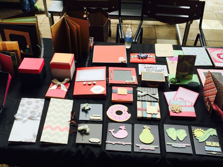 a table topped with lots of different types of cards and envelopes on top of it