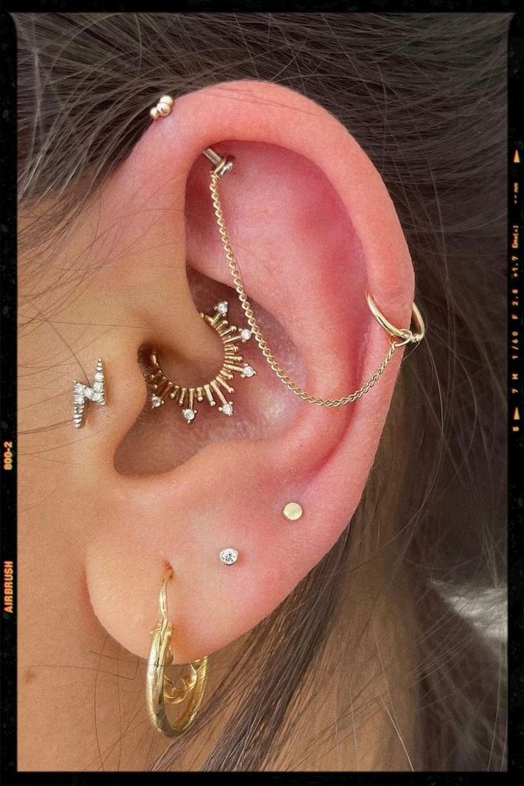 three different types of ear piercings on top of each other