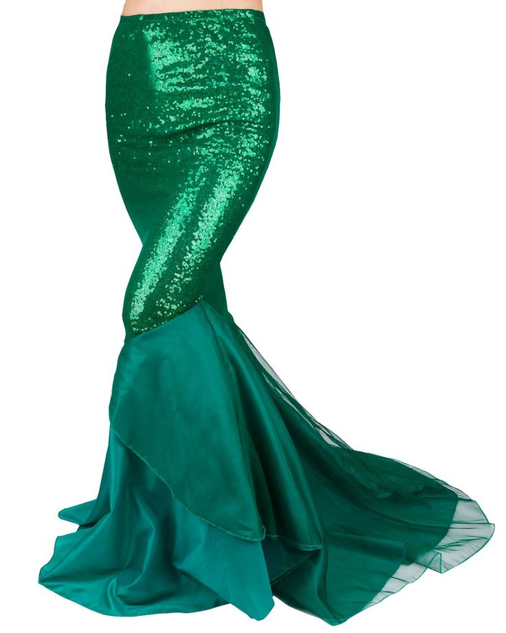 a woman in a green mermaid costume with her hands on her hips and one hand over her head