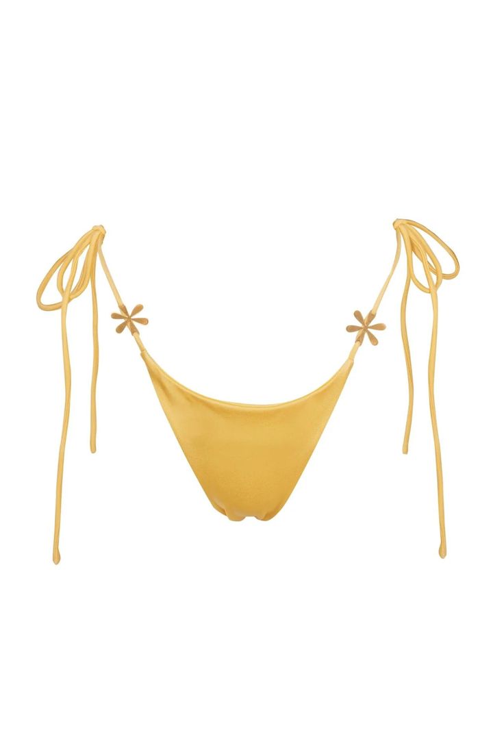 The Juliana Bikini Bottom in Marigold. A classic string triangle cut, adorned with brushed gold hardware featuring ASTA RESORT's signature Delilah motif, brings an elevated look to a staple style—perfect for your next holiday.  Constructed from Italian lycra containing 50% recycled polyester. Adjustable Gold Triangle Top Swimwear, Gold Adjustable Triangle Top Swimwear, Chic Gold Swimwear For The Pool, Chic Gold Swimwear For Pool, Gold Tie-side Bottom Swimwear For Swimming, Gold Tie-side Swimwear For Pool, Gold Tie-side Bottom Swimwear For Pool, Gold Party Beachwear Swimwear, Chic Gold Swimwear For Summer