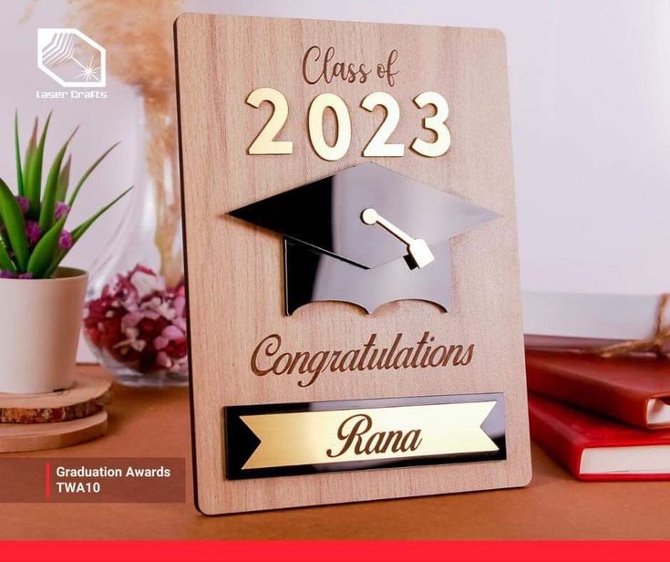 a wooden plaque with a graduation cap on it that says class of 202 congratulations rona