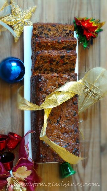 some food is sitting on a table with christmas decorations