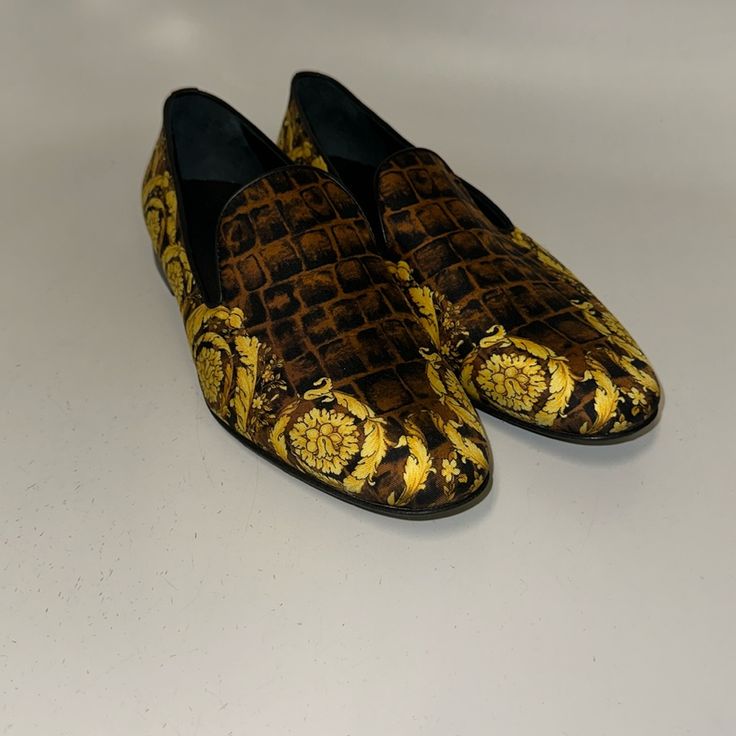 Brand New Never Worn. Satin Barocco Print Slip In Loafer. Excellent Condition. Luxury Gold Loafers For Party, Luxury Brown Loafers For Galas, Gold Slip-on Loafers For Evening, Elegant Gold Loafers For Galas, Designer Loafers With Leather Sole For Galas, Luxury Party Loafers With Leather Sole, Luxury Dress Shoes With Branded Insole For Galas, Gold Formal Loafers With Branded Insole, Luxury Evening Loafers With Round Toe