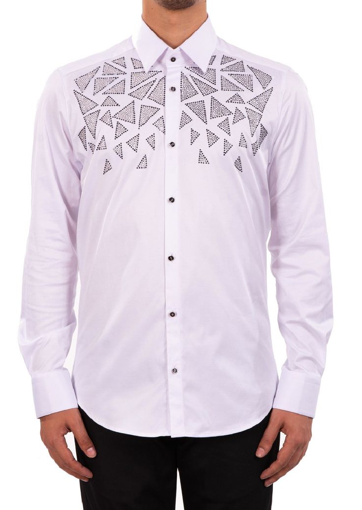 Limited edition- One of a kind Eye-catching studded rhinestone detailed shirt. A modern shirt with an unexpected edge. This white cotton shirt from Mondo is embellished with silver rhinestone. Looking sharp. Your style status can’t be messed with, and this shirt from Mondo makes that clear. Adorned with gold-tone rhinestones, this piece will toughen up any casual look. Eye-catching rhinestone details French placket Point collar Custom buttons Sleeves with Cufflinks Long sleeves with mitered Back Mens Party Shirt, Party Shirts Men, 50 Party, Studded Shirt, Rhinestone Shirt, Kurti Embroidery, Rhinestone Shirts, White Cotton Shirt, Embellished Shirt