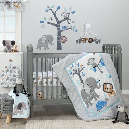 a baby's room with an elephant and giraffe theme