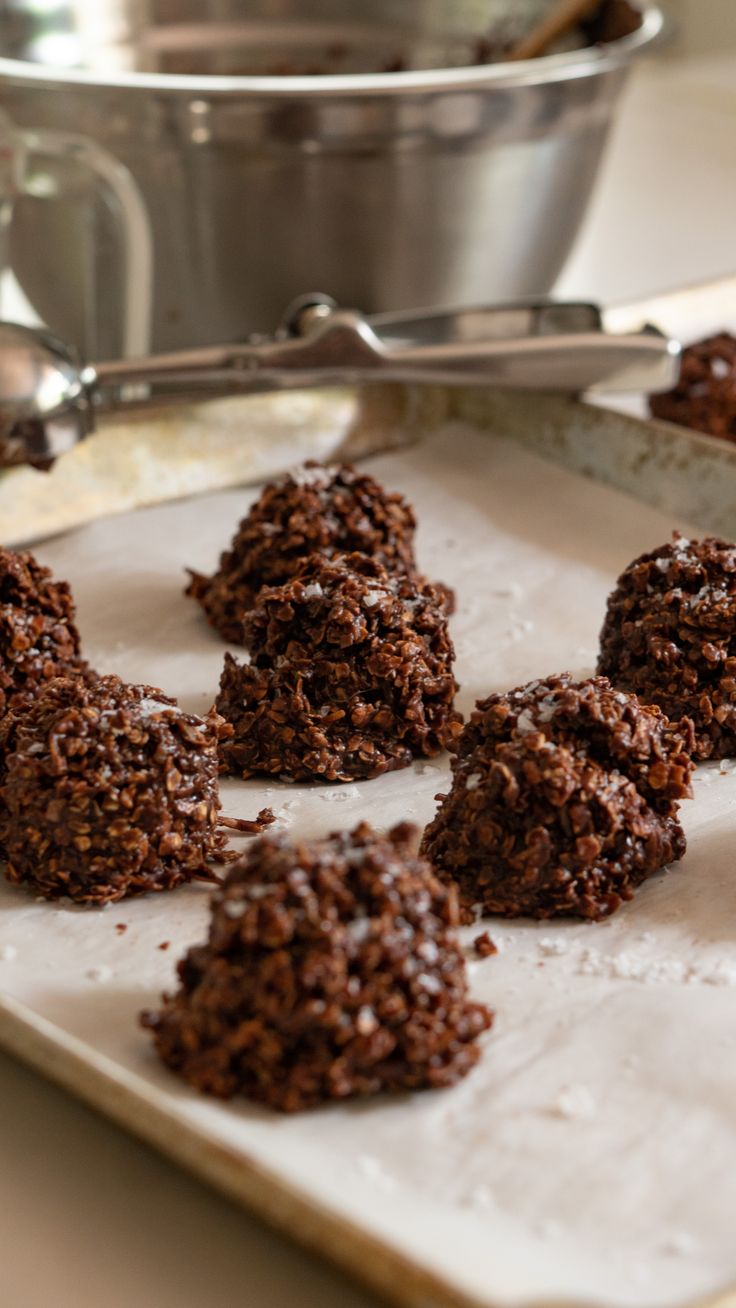 there are chocolate cookies on the tray ready to be eaten