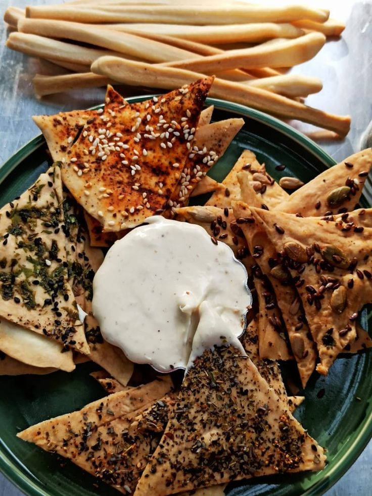 a green plate topped with lots of different types of food