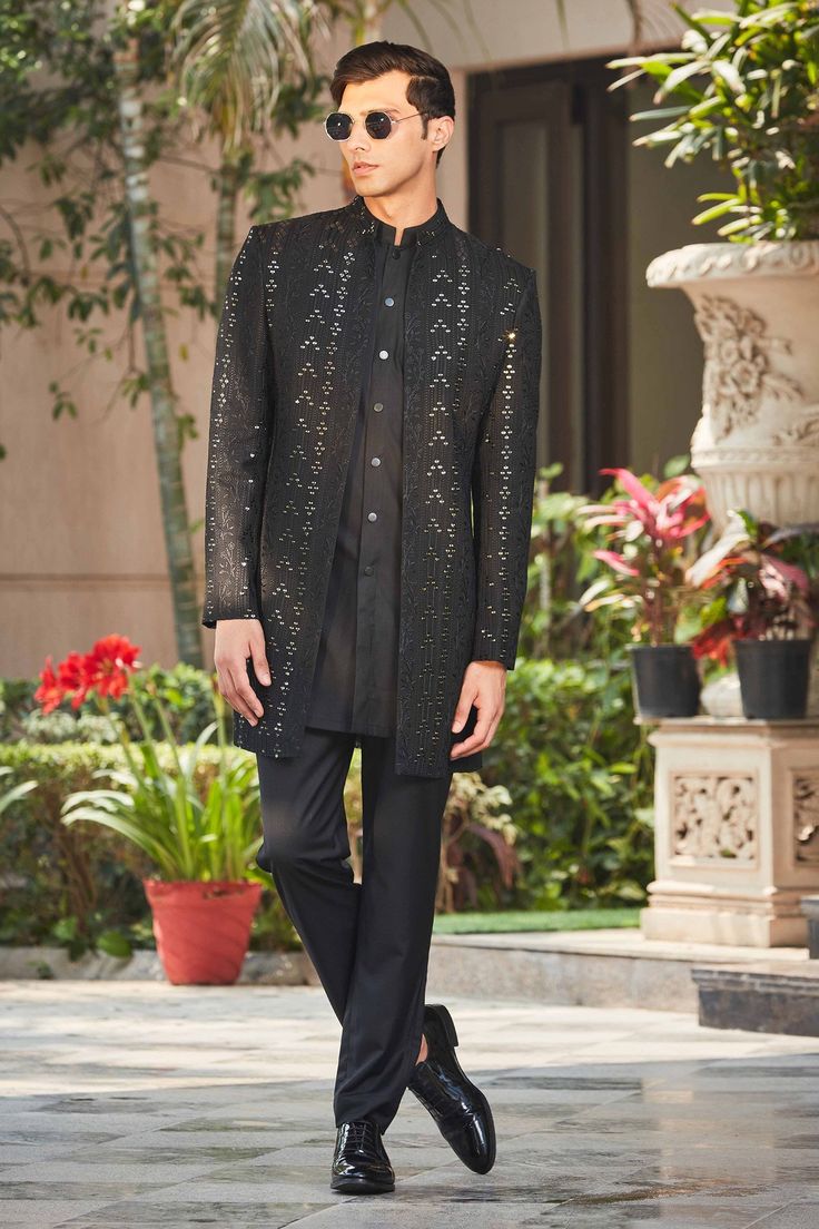 Black full sleeve front open achkan jacket, accentuated with all over floral chikankari embroidery in zari embellishments. Paired with an inner kurta and pant.
Components: 3
Pattern: Embroidery
Type Of Work: Chikankari, Zari
Neckline: Stand Collar
Sleeve Type: Full Sleeves
Fabric: Achkan Jacket: Georgette Chikankari, Kurta: Terry wool Suiting, Pant: Terry wool Suiting
Color: Black
Other Details: 
Front button closure kurta
Occasion: Sangeet,Cocktail and Reception - Aza Fashions Luxury Bandhgala With Chikankari Embroidery For Groom, Luxury Nehru Jacket With Chikankari For Traditional Ceremonies, Luxury Long Nehru Jacket With Chikankari Embroidery, Luxury Long Sleeve Nehru Jacket With Chikankari Embroidery, Luxury Winter Nehru Jacket With Chikankari Embroidery, Luxury Chikankari Embroidered Nehru Jacket For Eid, Luxury Chikankari Embroidery Outerwear For Reception, Luxury Nehru Jacket With Chikankari Embroidery For Ceremonies, Luxury Nehru Jacket With Chikankari Embroidery