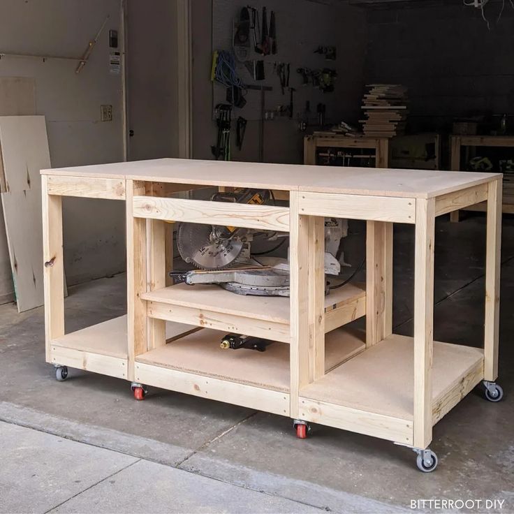 a workbench made out of plywood and wood with wheels on the floor