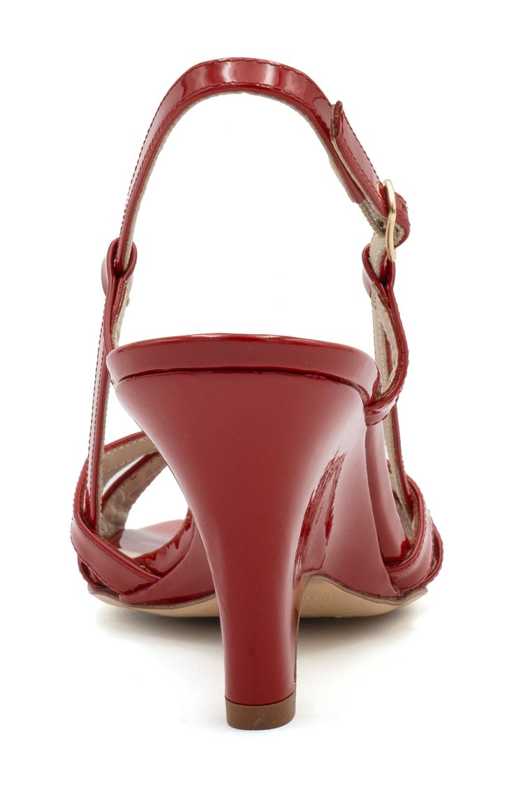 Slender straps crisscross over the vamp of a slingback leather sandal grounded by a cushioned footbed and architectural heel. 2 1/2" heel Adjustable slingback strap with buckle closure Memory foam cushioning Leather upper and lining/leather and rubber sole Made in Italy Strappy Slingback Sandals With Heel Strap For Evening, Evening Strappy Slingback Sandals With Heel Strap, Leather Strappy Slingback Sandals For Evening, Chic Strappy T-strap Sandals With Adjustable Strap, Evening Heels With Cross Straps, Evening Slingback Strappy Sandals, Evening Slingback Strappy Pumps, Party Slingback Strappy Sandals With Adjustable Straps, Party Strappy Slingback Sandals With Adjustable Straps