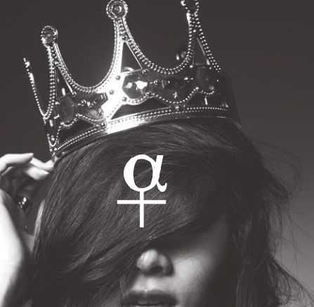 a woman with a crown on her head and the word q in front of her face