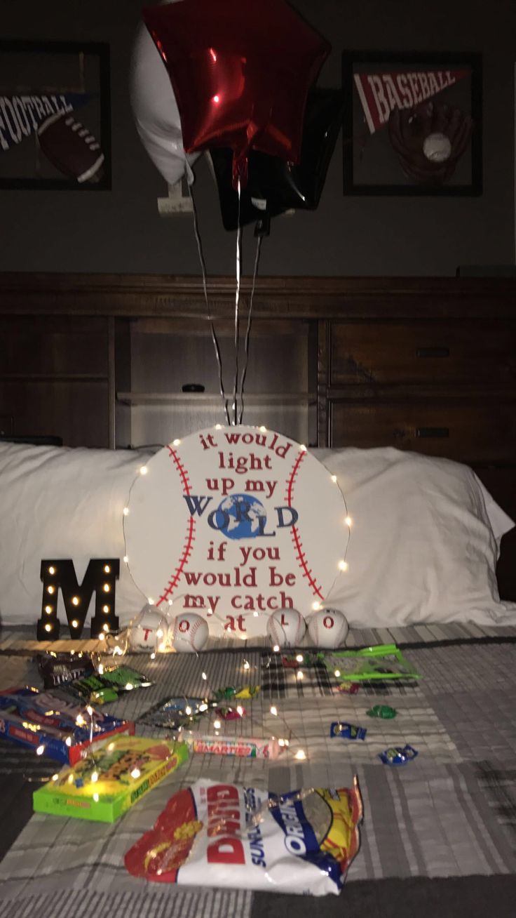 a baseball themed birthday party with balloons and confetti on the bed at night