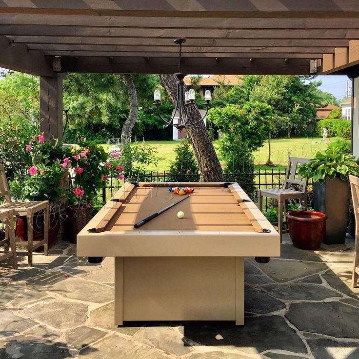 a pool table in the middle of a patio