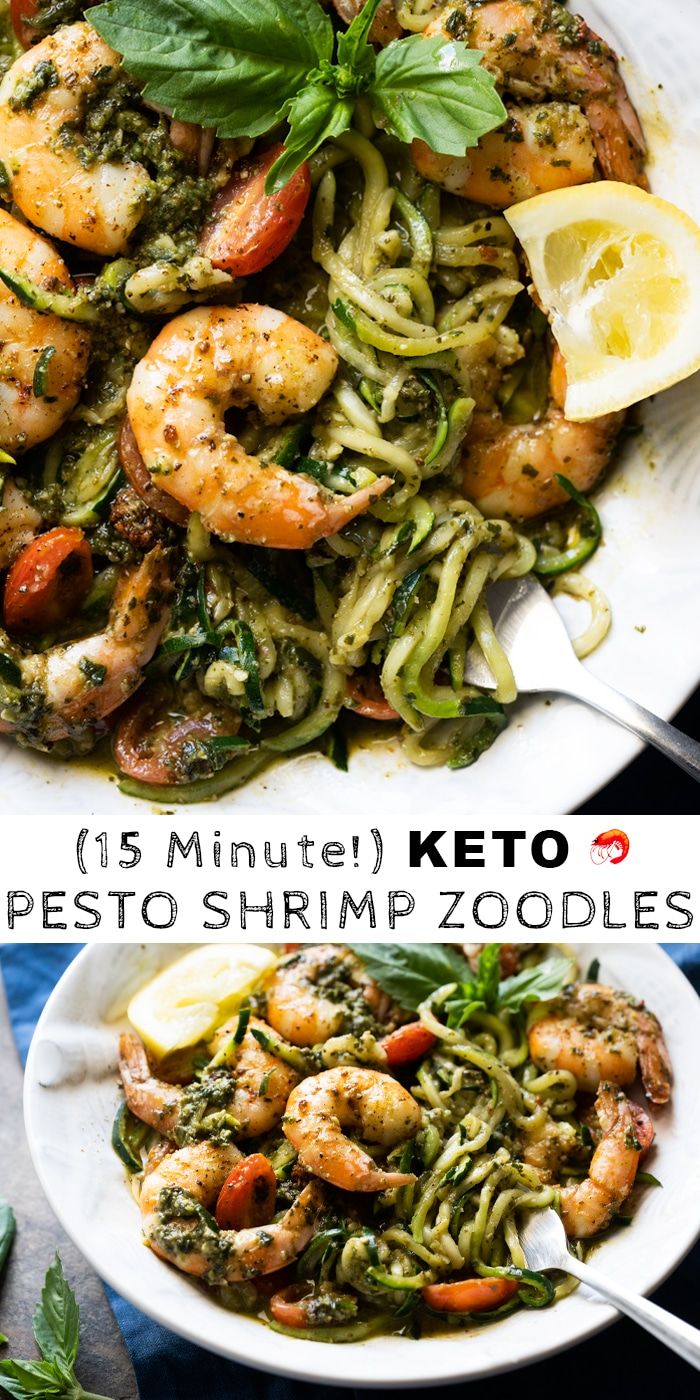 two plates with shrimp and pesto pasta on them, one has lemon wedges