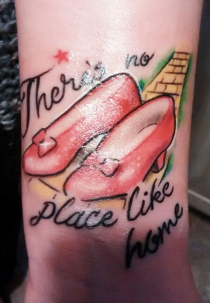 there is no place like home tattoo on the arm