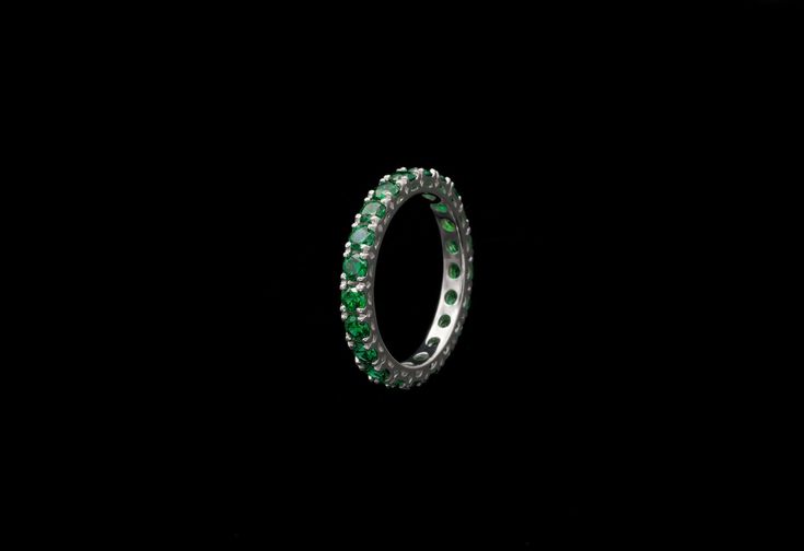 Elegant eternity wedding band ring featuring sparkling brilliant cut created emerald set all around the band totaling 2.50carat. Ring is crafted from solid 14k white gold with high polished finish. Our created diamonds are synthetic simulants that feature brighter D color , FL / VVS1 clarity and ideal cut making them visually indistinguishable from natural diamonds that cost thousands of dollars. We only use high quality solid gold/silver in our jewelry, WE DO NOT sell fake gold/silver jewelry. Green Prong-set Eternity Band For Anniversary, Green Eternity Band With Prong Setting For Anniversary, Classic Green Eternity Promise Ring, Green Vvs Clarity Eternity Band For Anniversary, Elegant Green Round Cut Eternity Band, Emerald Eternity Band With Prong Setting Gift, Anniversary Emerald Eternity Band With Prong Setting, Classic Green Gemstone Eternity Band, Green Emerald Round Cut Eternity Band