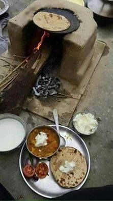 food is being prepared in an outdoor oven