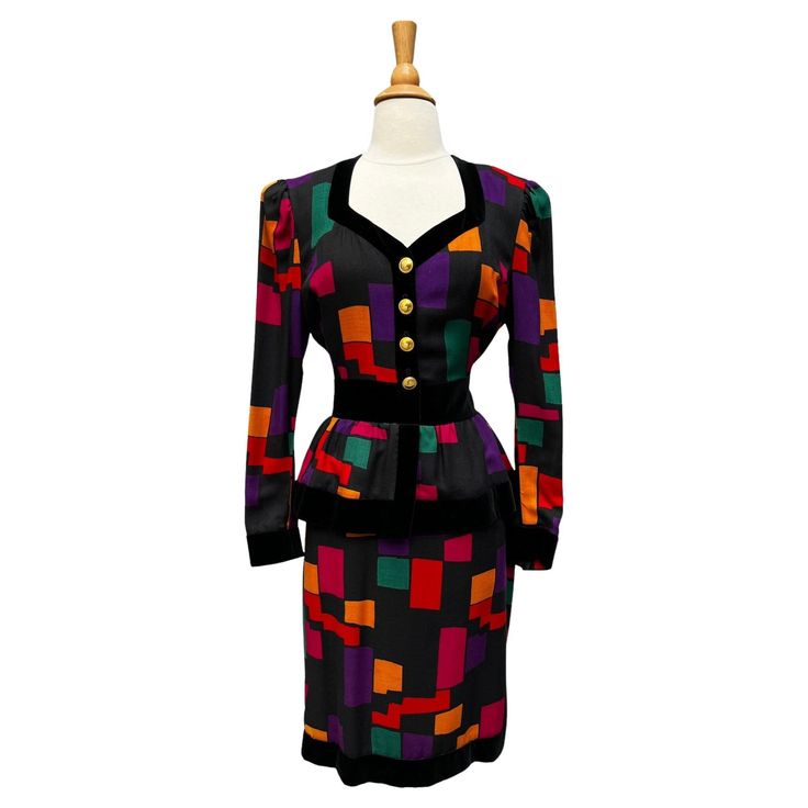 vintage Escada dress. Black wool with a colorful geometric pattern and bllack velvet trim. Gold buttons on the bodice. Peplum waist. Long sleeves with button cuffs. Dress falls to knee length. Back zip closure. Dress is lined, sleeves are unlined. Circa 1980s - 1990s Escada by Margaretha Ley Made in W Germany Tagged size 40 Wool/Silk/Cotton Velvet Black/Purple/Orange/Teal/Pink Excellent Vintage Condition. Dry Cleaned. ✂----M e a s u r e m e n t s: all in inches. Bust 36-38 Waist 28/29 Hips 36 Le Jewel Tone Dress, Escada Dress, Colorful Geometric Pattern, Blue Striped Top, 80s Style, Velvet Trim, Teal And Pink, Cotton Velvet, Dress For Sale