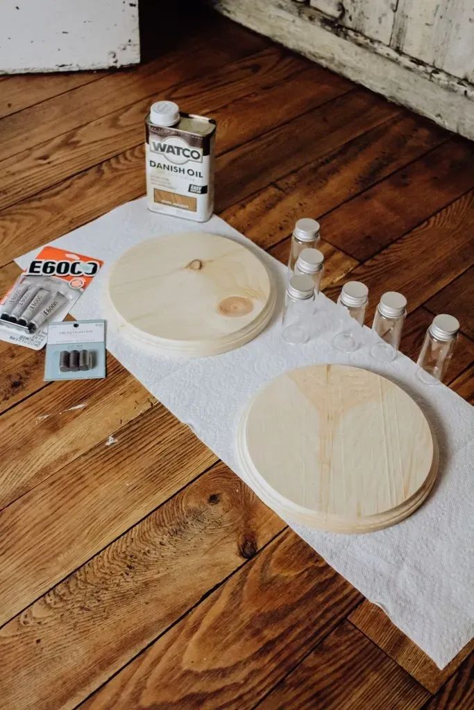 the table is set up with some crafting supplies for making wooden bowls and plates