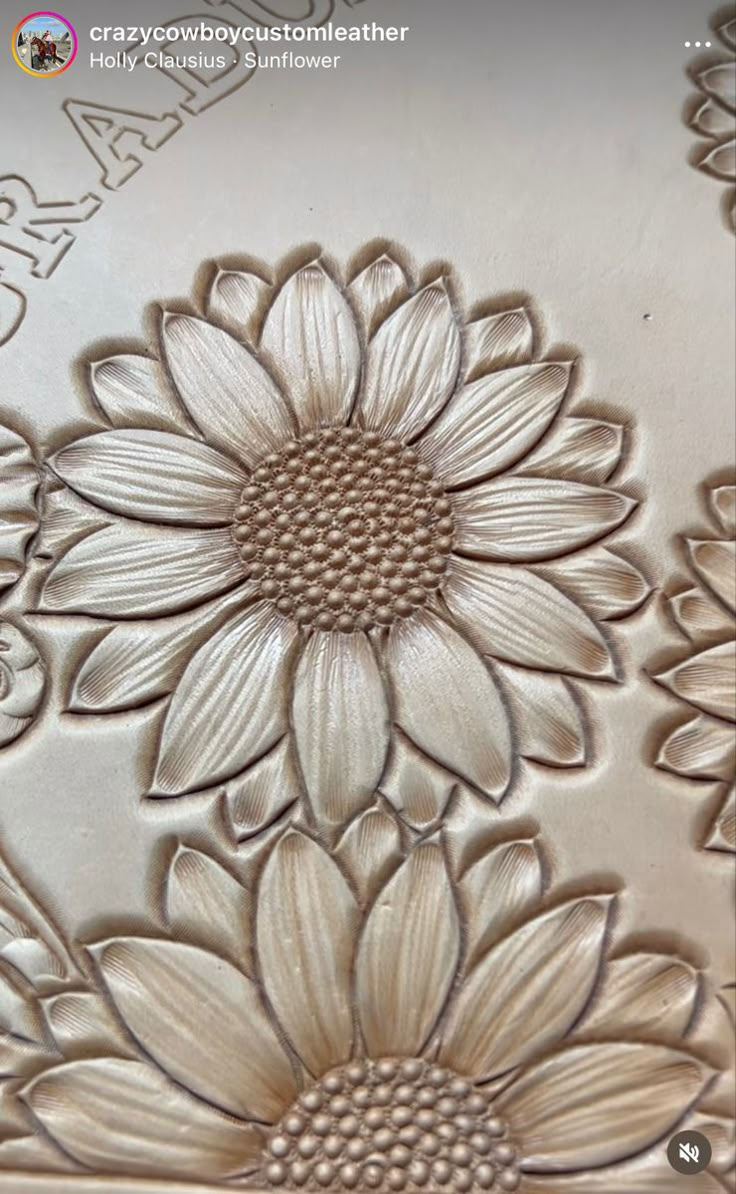 an intricately designed metal plate with flowers on it