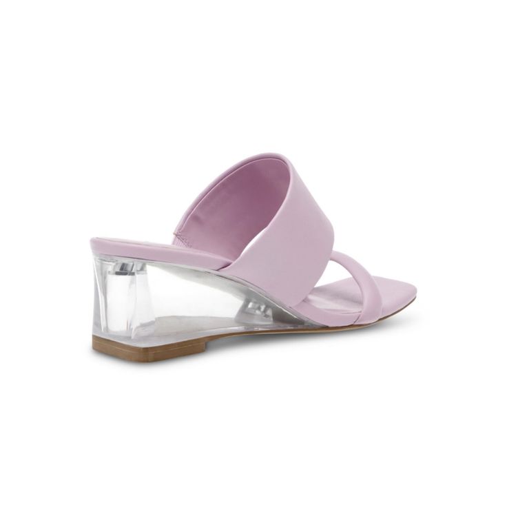 The Gaia Sandal is the perfect summer sandal that can be worn on any occasion. This stylish sandal is made with materials that provides extra comfort and flexibility while wearing. The clear wedge heel adds a modern look to the shoe. Description: - Closure Type: Slip-on- Heel Height: 2"- iFlex Technology- Faux Leather- Colors: Lilac and White Free Shipping Clear Strap Synthetic Sandals, Clear Synthetic Sandals With Clear Strap, Clear Strap Open Toe Sandals, Modern Sandals With Block Heel For Beach, Modern Beach Sandals With Block Heel, Summer Clear Wedge Sandals With Clear Strap, Clear Open Toe Wedge Sandals, Spring Clear Strap Wedge Sandals, Clear Wedge Sandals For Summer