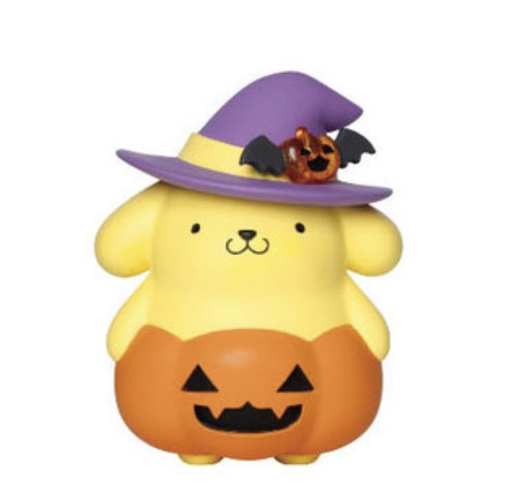 a yellow bear with a purple hat and pumpkin