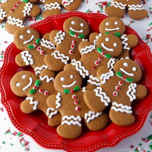 a red plate topped with lots of ginger cookies