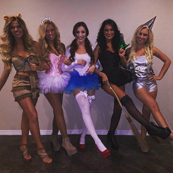 the girls are dressed up in costumes for halloween