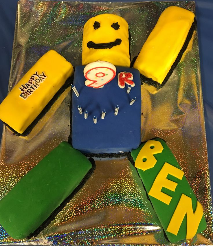 a cake made to look like spongebob is on a plastic tray with other items