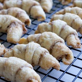 several pastries on a cooling rack ready to be baked in the oven for consumption