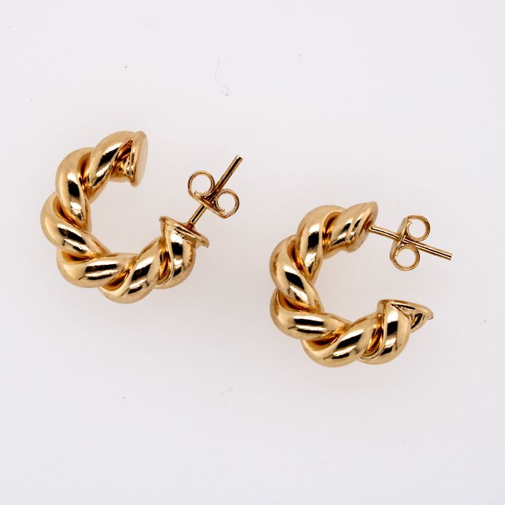 Named after our mother/grandmother, the Barbara earrings are a modern take on a pair of her much loved hoops. Two intertwined polished gold strands create the classic circular shape. **Gold filled 14k gold over brass. *Waterproof. 3 Sizes Barbara diameter is 1.25" Mini Barbara diameter is .75" Huggie diameter is .50" *Waterproof but will be damaged by chlorine and harsh liquids. **Our gold filled earrings have layers of 14k gold over brass. They have the look and color of solid gold earrings and Modern Twist Yellow Gold Earrings With Polished Finish, Modern Twist Everyday Earrings, 14k Yellow Gold Twisted Earrings, Modern Twist 14k Gold Round Earrings, Modern Twist Polished Yellow Gold Earrings, 14k Gold Round Earrings With A Modern Twist, Modern Twist 14k Yellow Gold Earrings, Yellow Gold Round Earrings With A Modern Twist, Modern Twist Yellow Gold Round Earrings