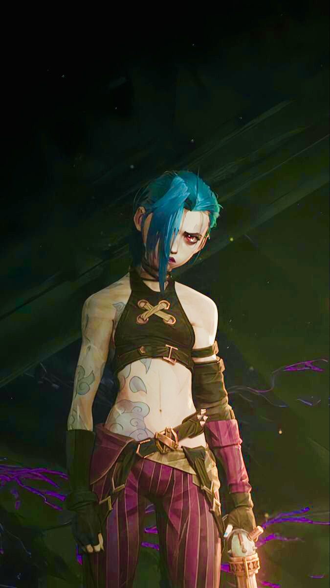 a woman with blue hair and tattoos standing in front of a black background wearing purple pants