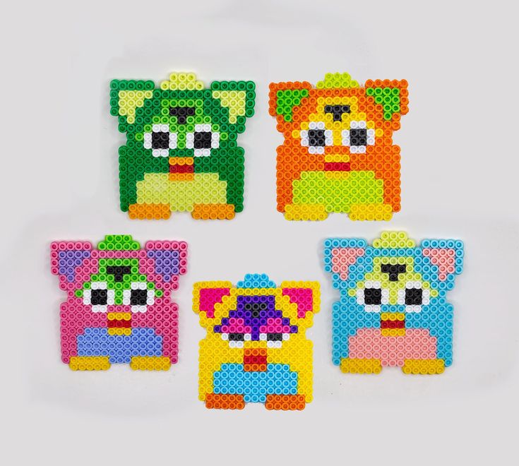 four pieces of perler bead art on a white background