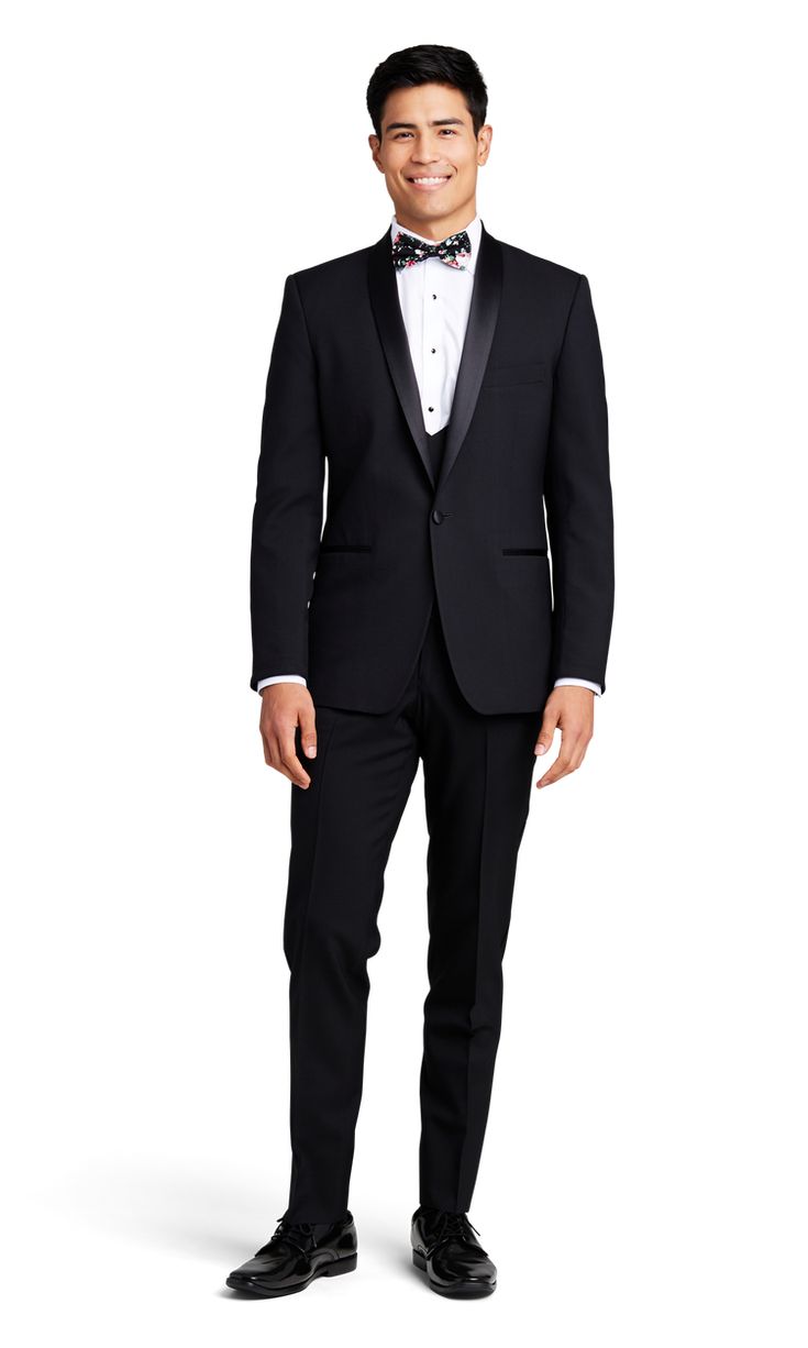 A slim black tuxedo with one button and a shawl lapel. Black Tuxedo With Pressed Crease For Evening, Black Evening Tuxedo With Pressed Crease, Tailored Tuxedo With Shawl Collar For Formal Events, Elegant Single Button Tuxedo For Party, Black Evening Suit With Shawl Collar, Black Shawl Collar Evening Suit, Classic Tuxedo With Shawl Collar For Black-tie Events, Classic Fitted Tuxedo With Shawl Collar, Classic Shawl Collar Tuxedo For Black-tie Events