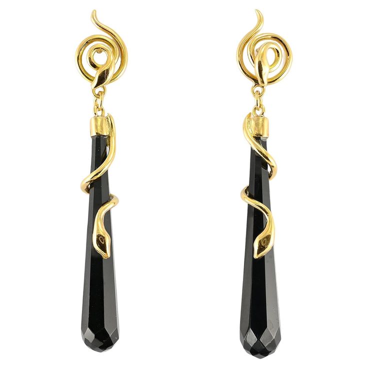 These beautiful long torpedo earrings are Art Deco period, 1925 ca Hand crafted of solid 18 KT gold with a fascinating snake motif coiling around a long drop of Black Onyx multifaceted torpedo shaped, top is a snake coiling in round Italian origin Lovely condition keeping with age Unless otherwise stated boxes are for presentation only Further Details Below Metal: 18 Kt yellow gold, tested Hallmarks: none/worn – assay on the fasteners Gems: 2 pear faceted cut black onyx of 40 x 7 mm. Measures: 6 Snake Motif, A Snake, Art Deco Period, Black Onyx, Onyx, Hand Crafted, Art Deco, Jewelry Earrings, Gems