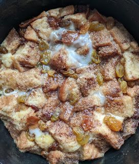 a crock pot filled with some kind of bread and pudding toppings on top of it