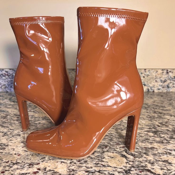 Steve Madden Leana Patent Heeled Boots In Cognac Per Steve Madden - The Color Is As Close To Accurate As Possible But Will Vary In Different Light Settings - I Would Call These A Warm Milk Chocolate Fondue Color - Inner Zip Closure - Brand New - No Box - No Tags - Heel Height Is 4” - Approx 4.6-4.7” Across Flattened Leg Opening (Top) - Some Very Mild Shelf Wear On Bottoms As Pictured - Synthetic Upper - Fabric/Synthetic Lining - Synthetic Sock - Manmade Outsole - Size 7m Fall Square Toe Heeled Boots With 4-inch Heel, Fall Heeled Boots With 4-inch Heel And Closed Toe, Fall Closed Toe Heeled Boots With 4-inch Heel, Fall Closed-toe Heeled Boots With 4-inch Heel, Fall Patent Leather Mid-calf Boots With Round Toe, Trendy Boots With Wrapped Heel And Round Toe, Patent Leather High Heel Boots For Fall, Fall Faux Leather Square Toe Heels, Fall Square Toe Heels With Wrapped Heel