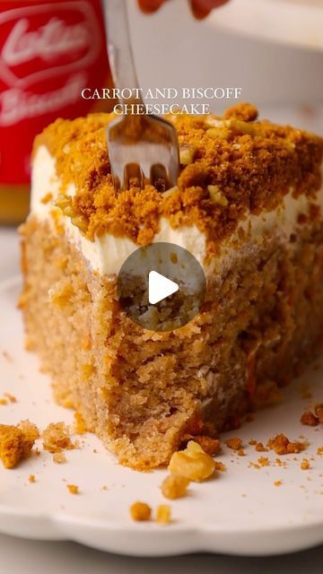 a piece of carrot and biscuit cheesecake on a white plate with a fork