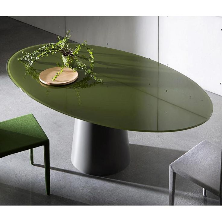 a green table and chairs in a room