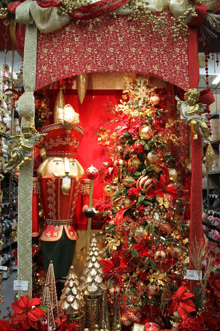 a christmas display with red and gold decorations