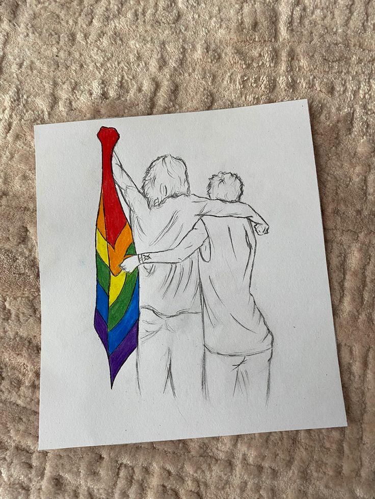 a drawing of two people hugging each other with a rainbow colored tie on the ground