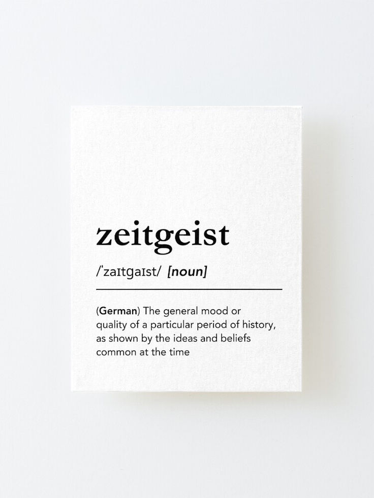 a piece of paper with the words zeitgeist on it and an information card attached to it