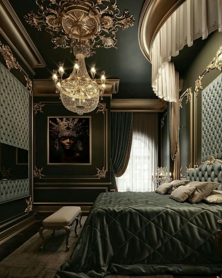 a bed sitting under a chandelier in a bedroom next to a painting on the wall