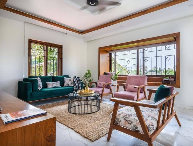 a living room filled with furniture and lots of windows