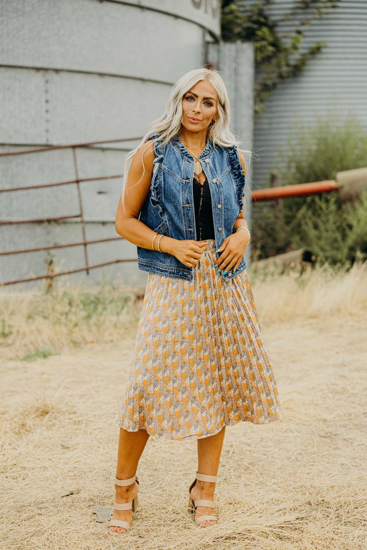 Introducing the must-have Cascade Skirt! This stunning midi length skirt features a beautiful floral print, creating a romantic and feminine look. The pleated design adds texture and movement to your outfit, while the banded waist keeps you comfortable all day long. Perfect for fall, this western skirt is a versatile addition to your wardrobe. Kiah is wearing size medium paired with The Diann Corset and The Dunstan Vest Bohemian Midi Length Spring Bottoms, Spring Tiered Pleated Skirt With Elastic Waistband, Fall Brunch Tiered Skirt, Flowy Maxi Skirt For Fall Brunch, Spring Pleated Midi Skirt, Casual Summer Maxi Skirt With Pleated Hem, Casual Ruffled Rayon Skirt, Casual Pleated Tiered Skirt With Elastic Waistband, Fall Pleated Maxi Skirt For Day Out