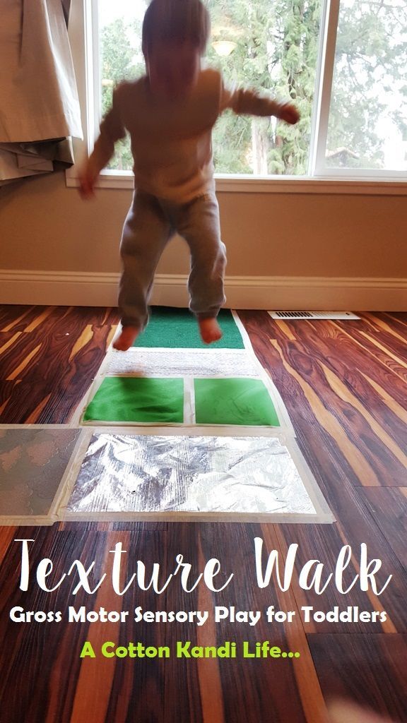 a baby standing on a mat with the words, texture walk gross motor play for toddlers