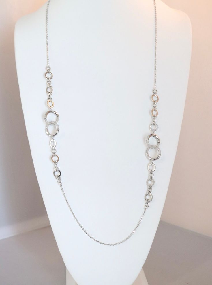 Upgrade your accessory game with our Long Silver Double Circle Necklace. The elegant double circle design adds a modern touch to any outfit. This necklace is durable and timeless. Elevate your style with this versatile piece. Elegant Double Chain Metal Necklace, Elegant Metal Double Chain Necklace, Chic Round Chain Necklace For Formal Occasions, Chic Long Silver Necklace, Elegant Silver Full Circle Necklace, Elegant Long Necklace With Adjustable Chain, Elegant Silver Double Chain Necklace, Elegant Round Metal Chain Necklace, Elegant Long Necklace With Round Pendant